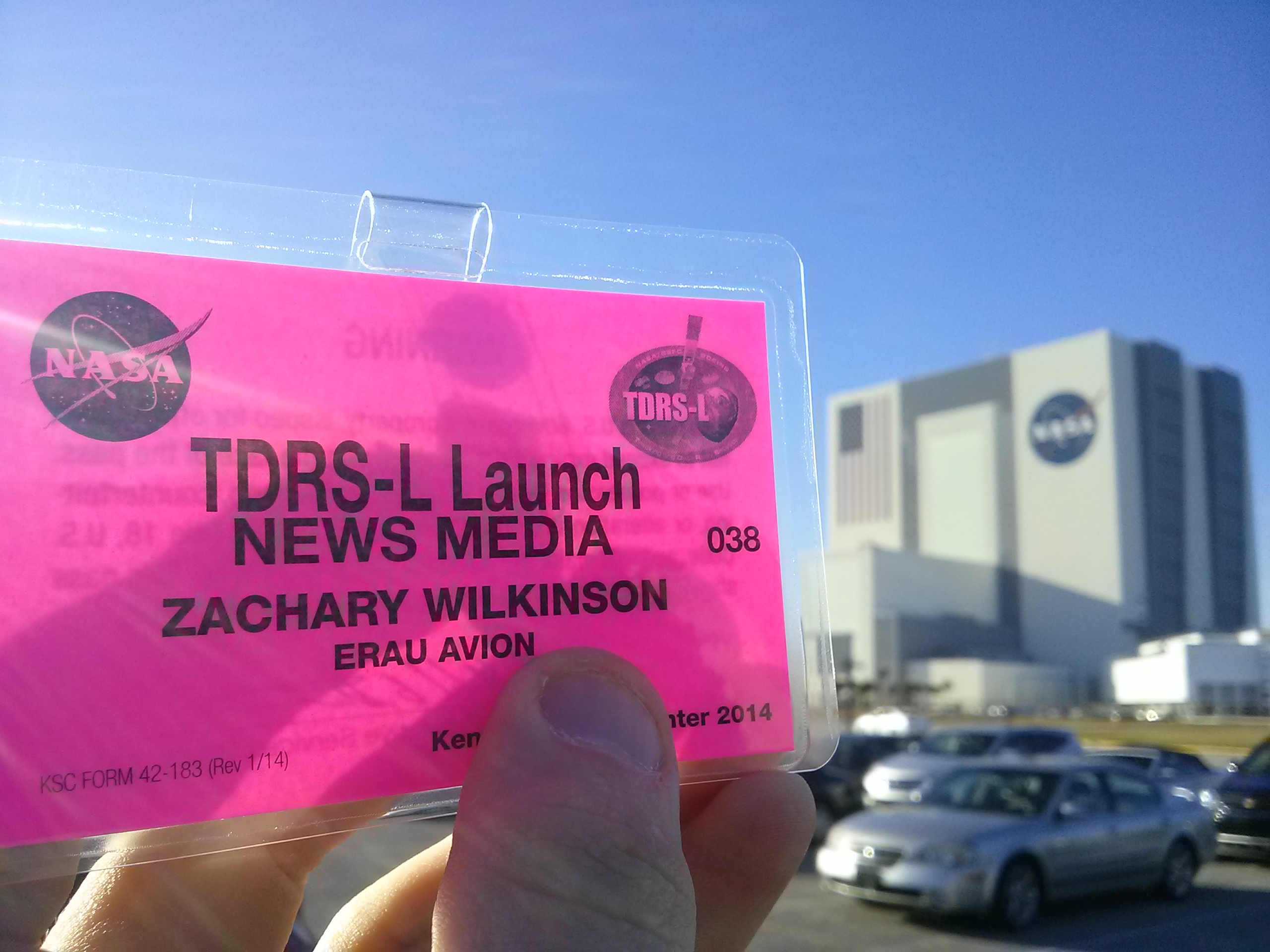 My press badge. SO COOL. In the background is the Vehicle Assembly Building (VAB)
