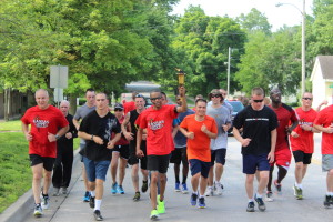 Local residents of Lansing, KS running the torch throughout the city. 