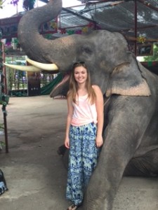Posing with another elephant from earlier in the trip